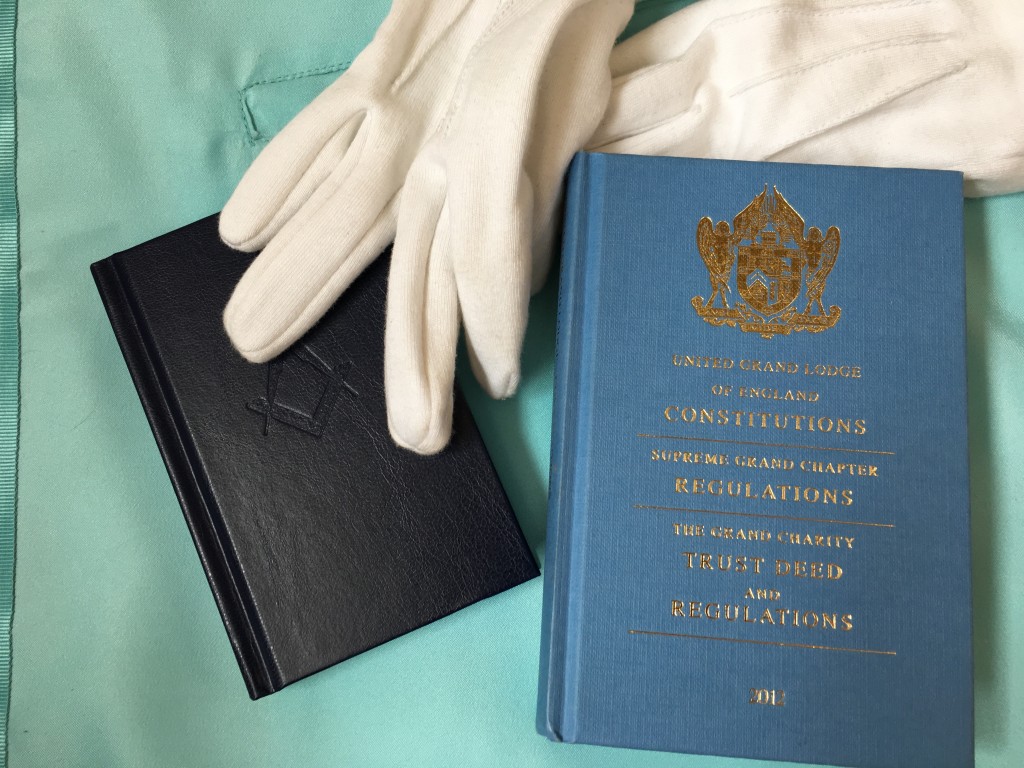 Masonic book of Constitutions and gloves